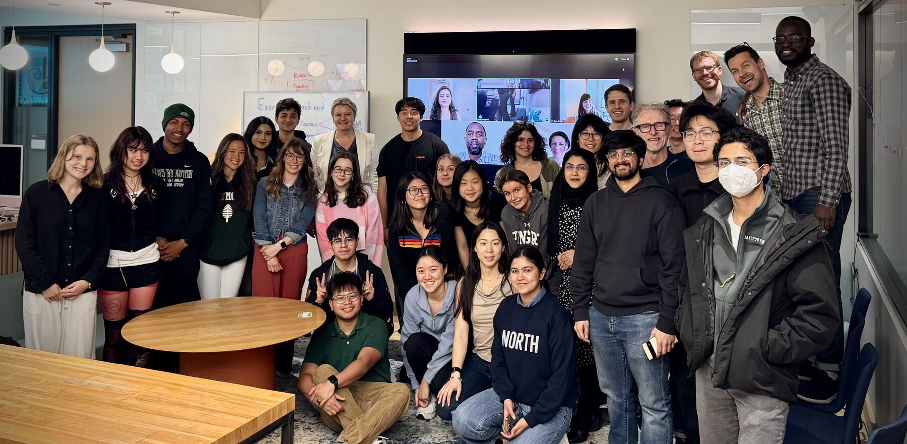 Evergreen students, faculty, and staff gathered for an early all-hands meeting, with remote teammates joining on screen